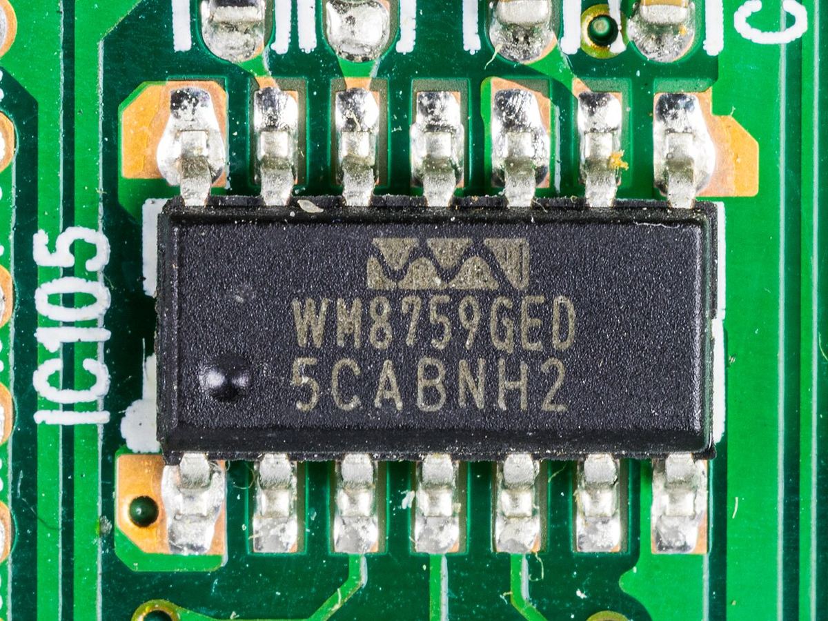 Close-up of a Wolfson WM8759 stereo DAC chip soldered to a circuit board