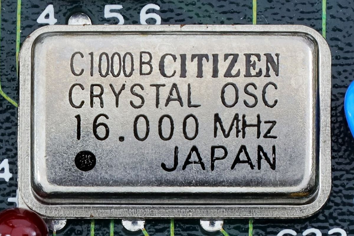 Citizen 16 MHz crystal oscillator in a metal can on a circuit board