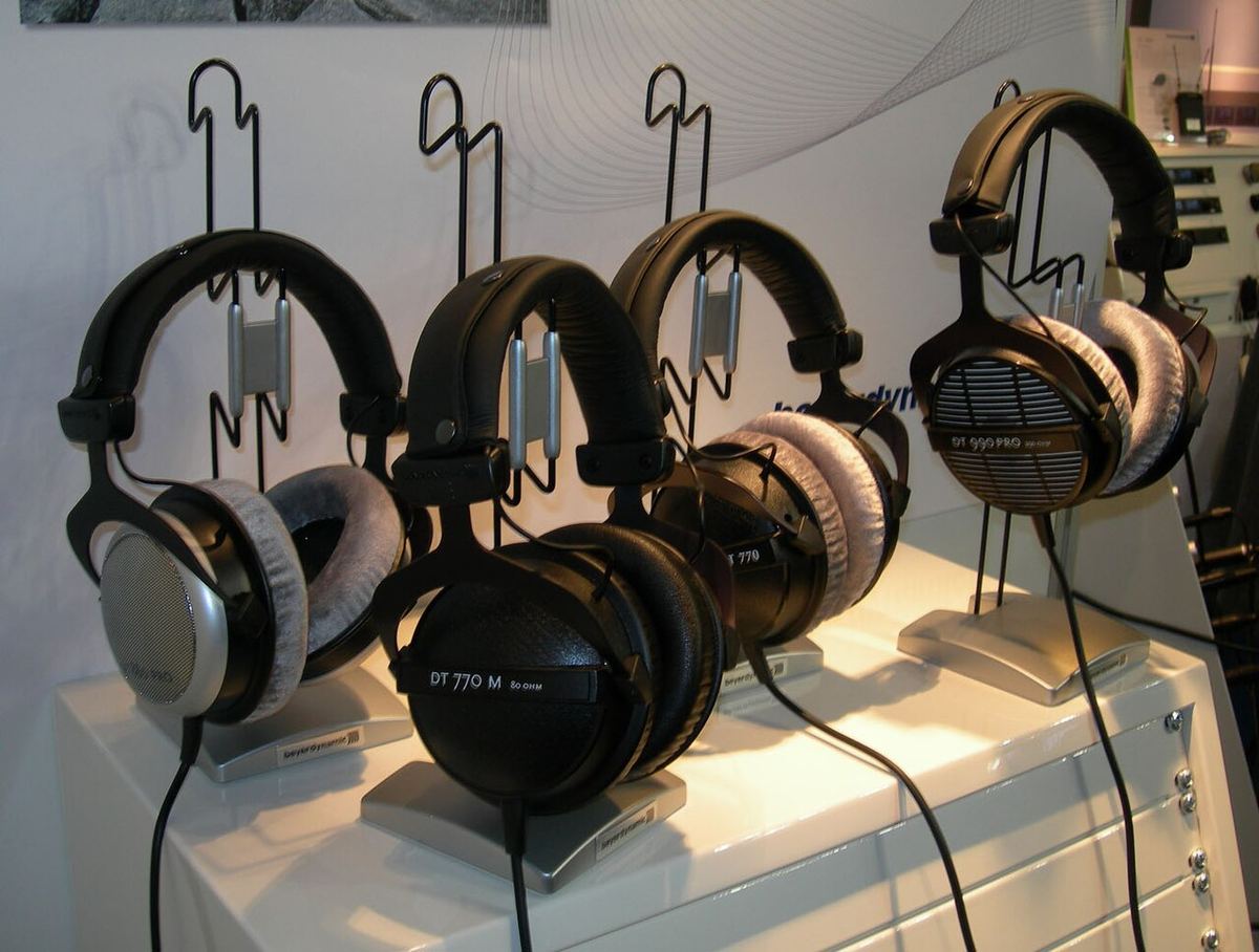 Several Beyerdynamic DT-series studio headphones displayed on hooks