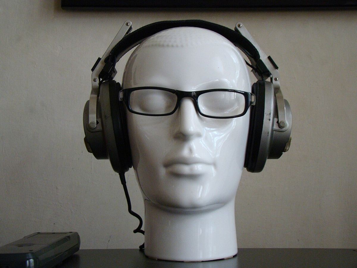 Over-ear headphones on a display mannequin head