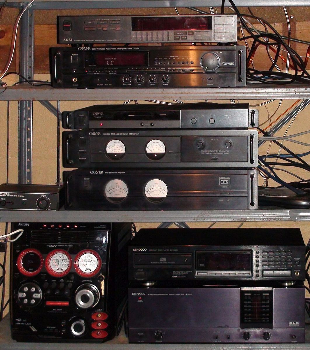Stack of hi-fi separates including a Carver preamplifier and power amplifiers with meters