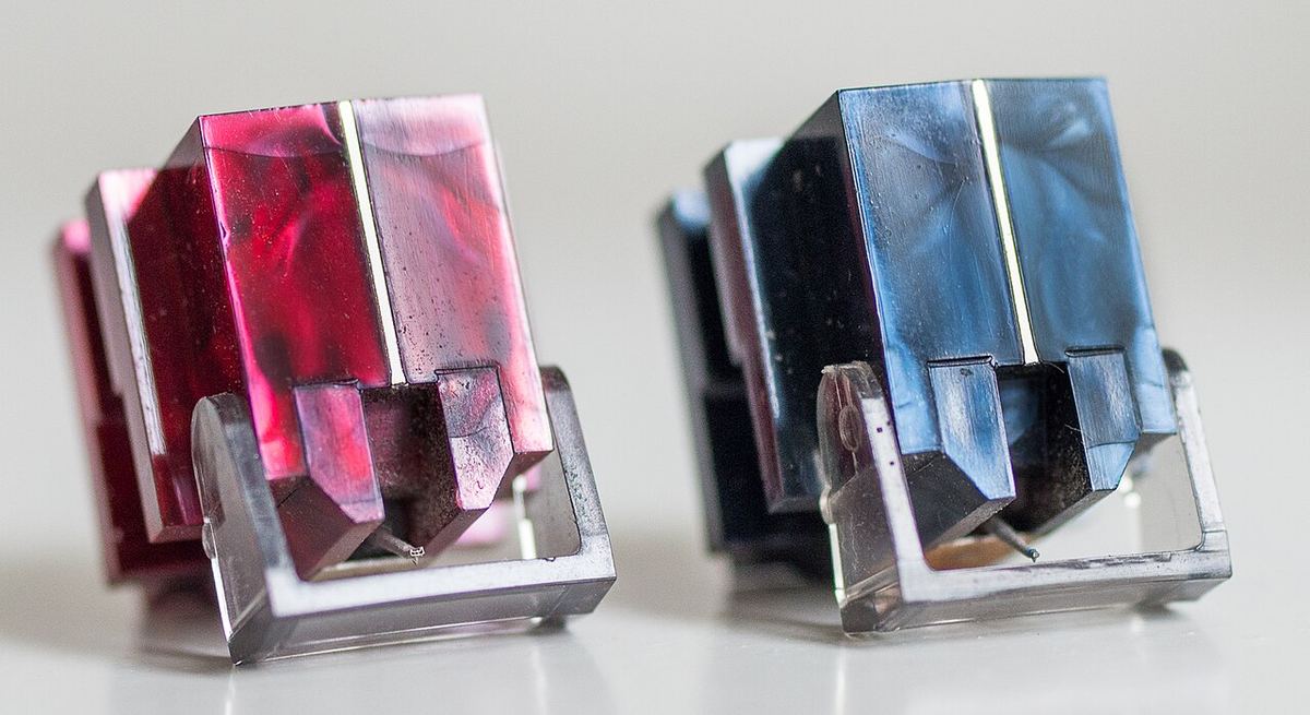 Two Denon moving-coil phono cartridges, the DL-110 and DL-160, side by side