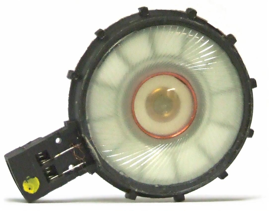 Dynamic headphone driver removed from its housing, showing the diaphragm and voice coil