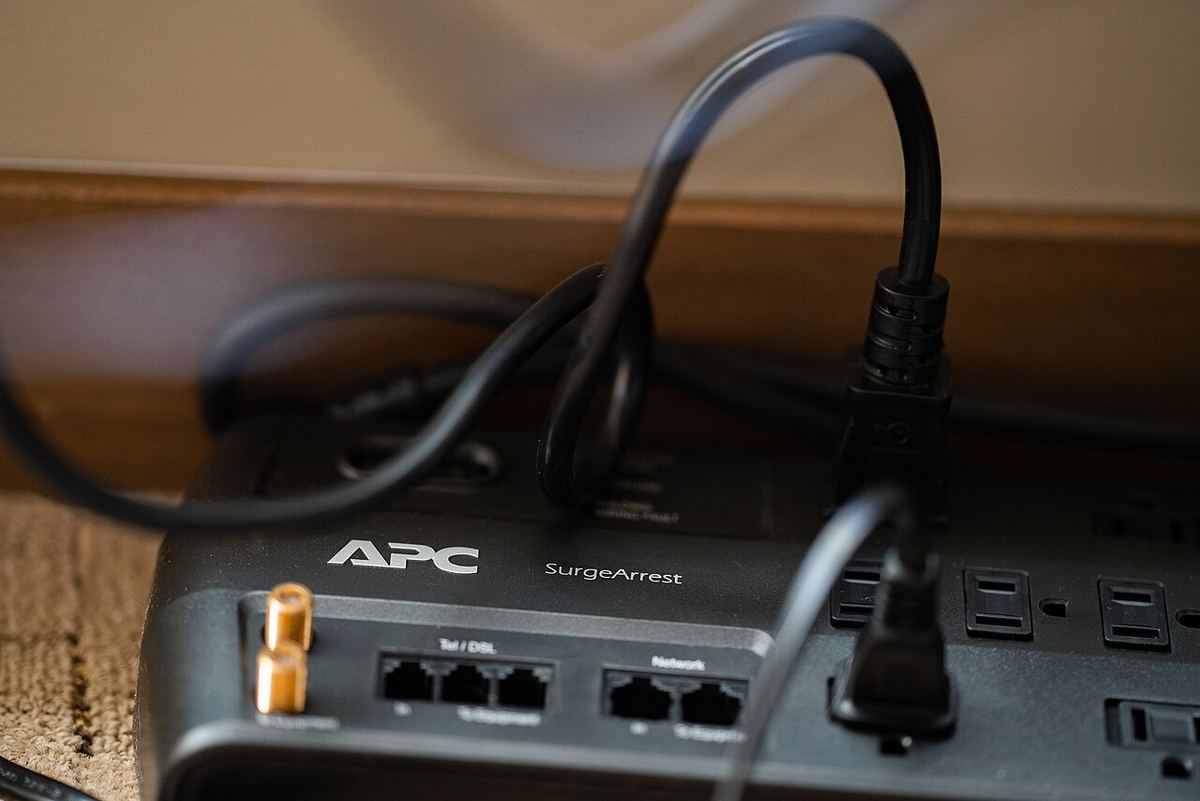APC SurgeArrest power strip with several plugs connected