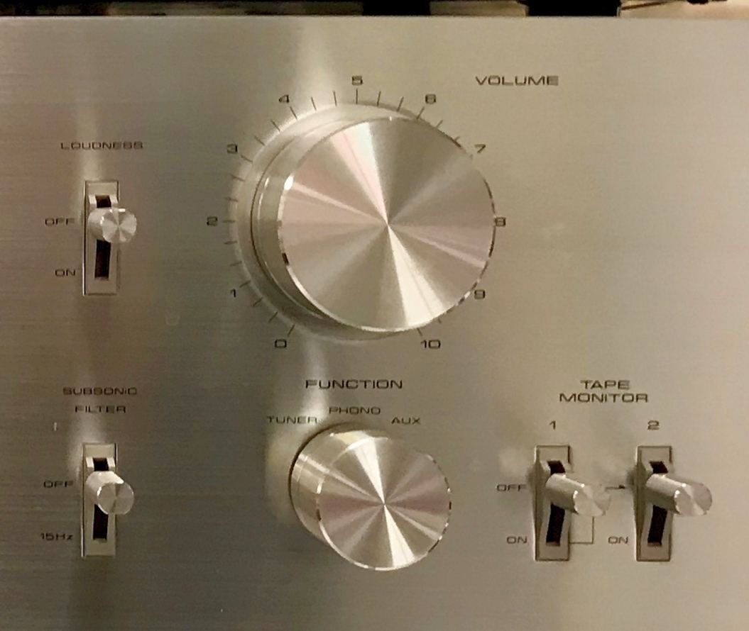 Volume control, input selector and tape monitor switches on a Pioneer SA-608 amplifier