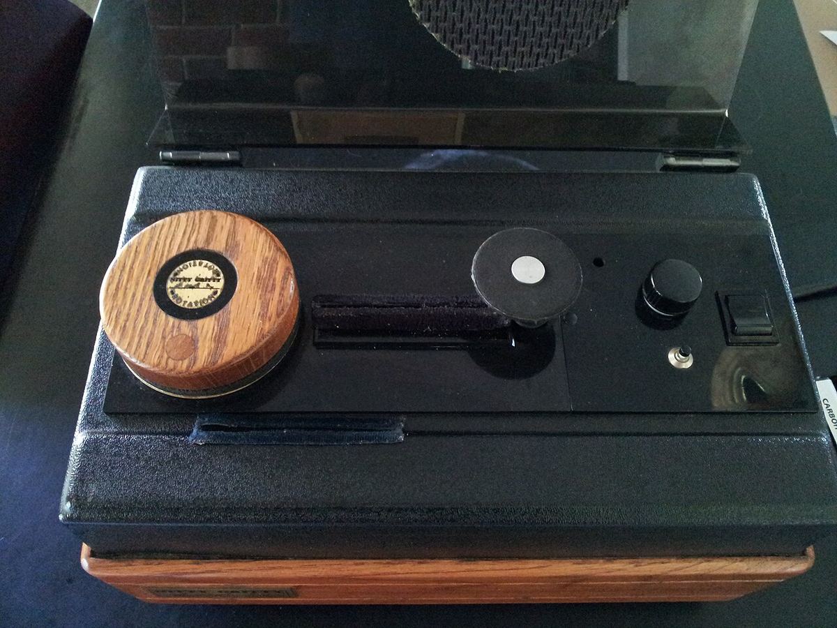 Nitty Gritty vacuum record cleaning machine with a record on the platter