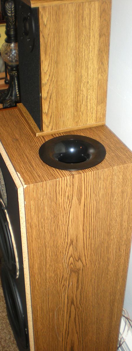 Flared bass reflex port tube installed in the top of a speaker cabinet