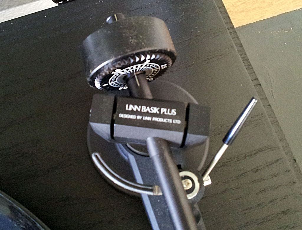 Close-up of a tonearm's rear counterweight and bearing housing