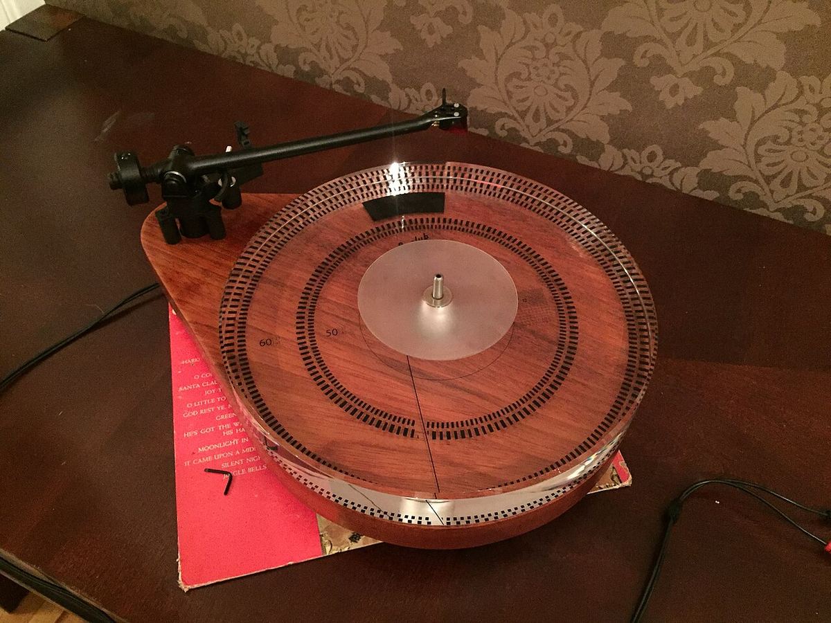 DIY turntable with a thick acrylic platter installed on a wooden plinth