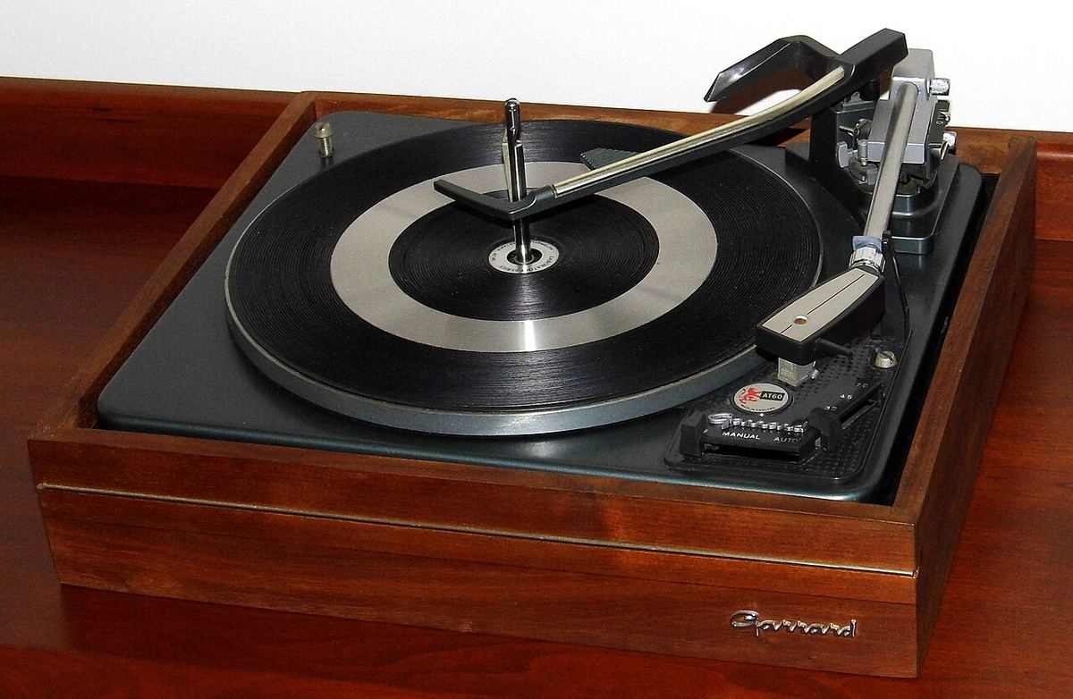 Vintage Garrard AT60 automatic turntable on an oiled walnut base